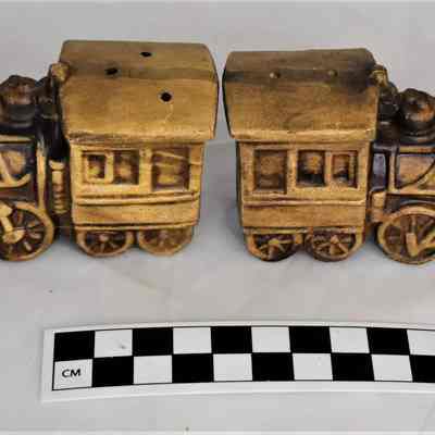 Other side and size comparison for train salt and pepper shakers.