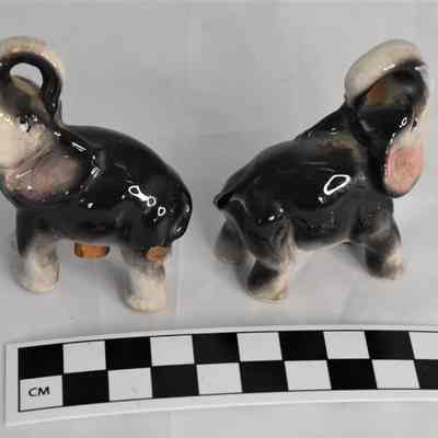 Other side and size comparison of elephant shakers.