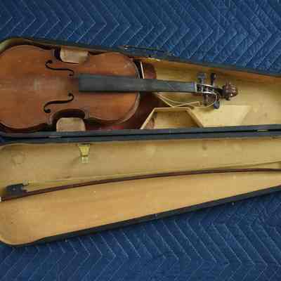 The opened case with the violin and bow.