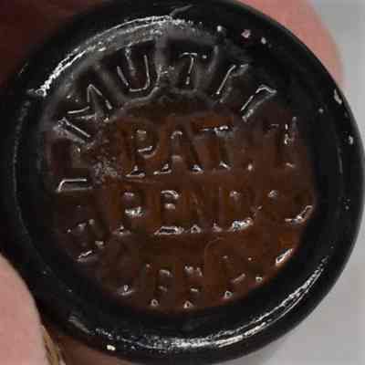 Marked "Muth Buffalo Pat. Pend." on the bottom of each shaker.