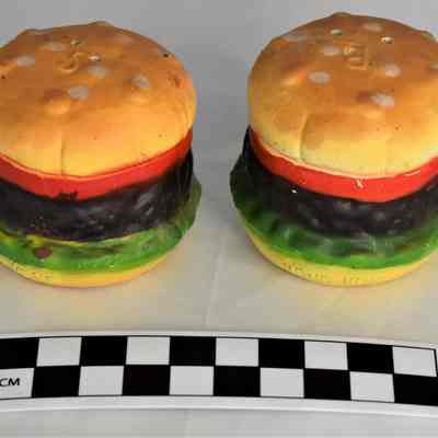 Other side and size comparison of hamburger salt and pepper shakers. Marked at the bottom "Hong Kong".