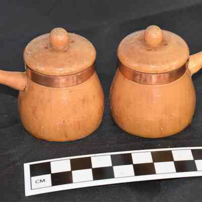 Back and size comparison wooden salt and pepper shakers.