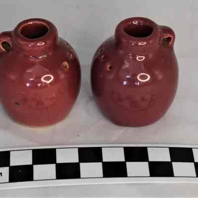 Other side and size comparison of jug salt and pepper shakers.