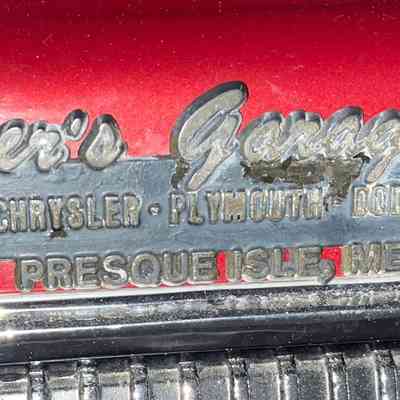 The Silver’s Garage dealer emblem on the back of the car.