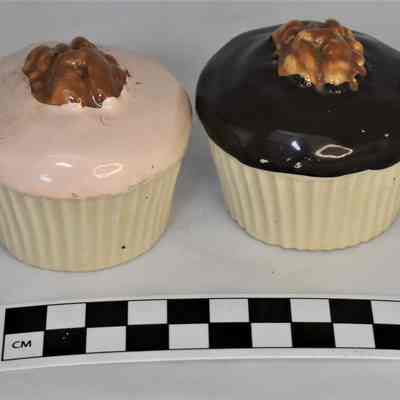 Other side and size comparison of cupcake salt and pepper shakers.