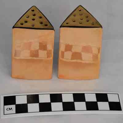 Back and size comparison of lusterware salt and pepper shakers.