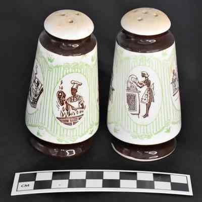 Back and size comparison of Dad and Mother salt and pepper shakers.