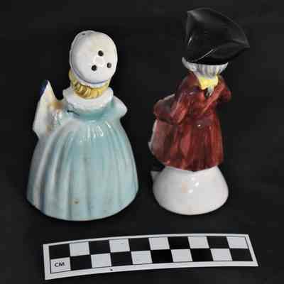 Back and size comparison of patriotic salt and pepper shakers.