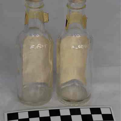 Back and size comparison of bottles salt and pepper shakers.