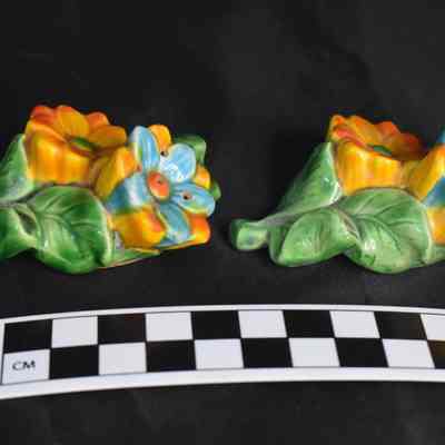Flipped view and size comparison of the floral salt and pepper shakers.