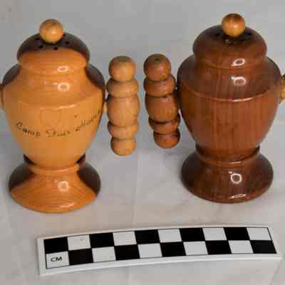 Back and size comparison of wooden teapot salt and pepper shakers.