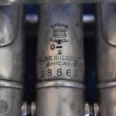 The "UNION MPBP B&SW LABEL 0 1/2 FRANK HOLTON & CO. CHICAGO 28863" inscription on the side of the middle valve.
