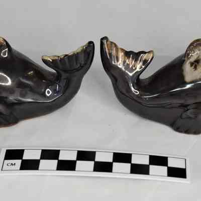 Other side and size comparison of whales salt and pepper shakers.