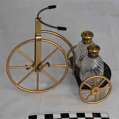 Other side and size comparison of tricycle salt and pepper set.