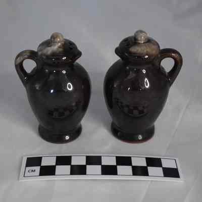 Back and size comparison of the brown jug salt and pepper shakers.