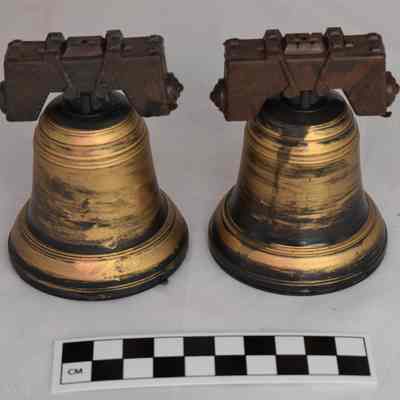 Back and size comparison of Liberty Bell salt and pepper shakers.