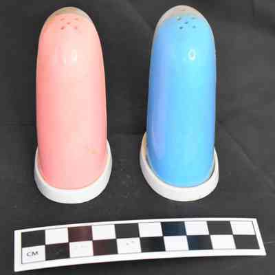 Back and size comparison of flamingo salt and pepper shakers.