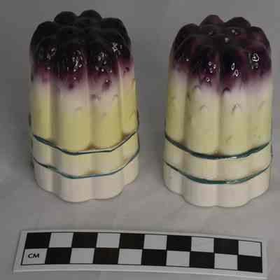 Size comparison for asparagus salt and pepper shakers.