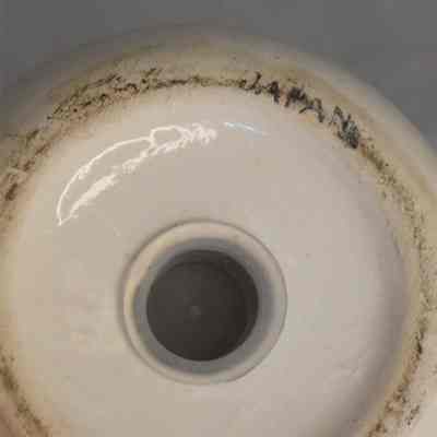 Bottom of potty with bee marked "Japan".