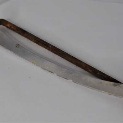 A serrated edge and a smooth edge