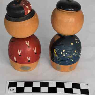 Back and size comparison of Kokeshi doll shakers.