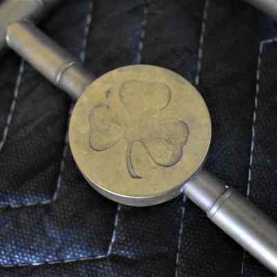 The clover decoration on the counterweight.