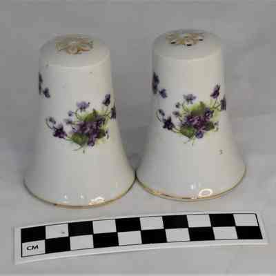 Back and size comparison of Lefton salt and pepper shakers.