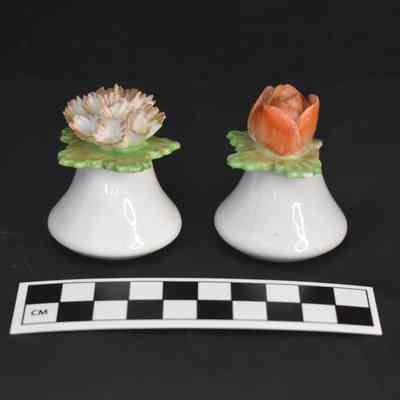 Flipped view and size comparison of the flower salt and pepper shakers.