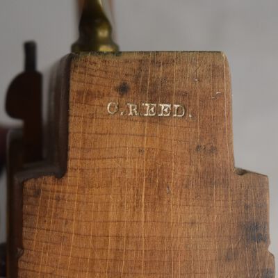 Marked "C. Reed" on the other end of plane.
