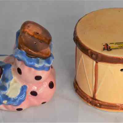 Circus clown salt shaker and drum pepper shaker.