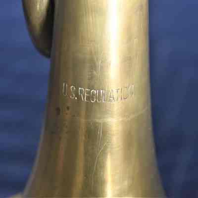 The "U.S. REGULATION" inscription near the bell.