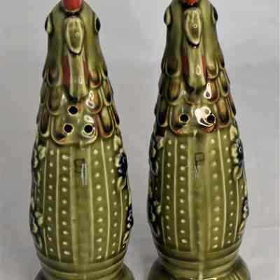 Fronts of green rooster salt and pepper shakers.