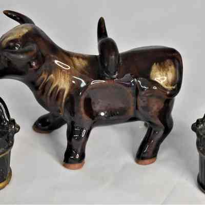 Ox and yoke with buckets salt and pepper shaker set separately.