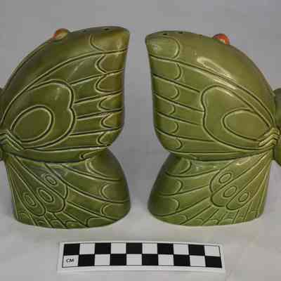 Back and size comparison of the butterfly salt and pepper shakers.