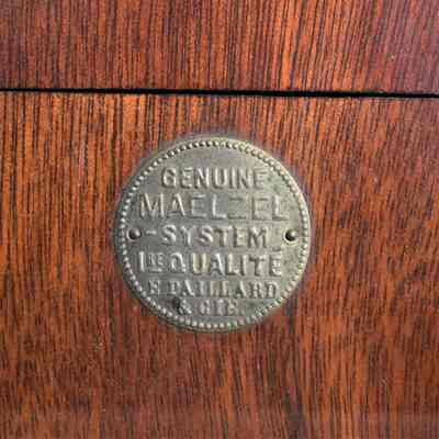 The, "GENUINE MAELZEL -SYSTEM 1 RE QUALITE E PAILLARD & CIE" inscription on the front.