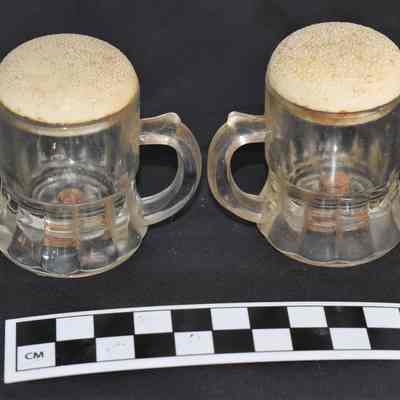 Back and size comparison of beer mug salt and pepper shakers.