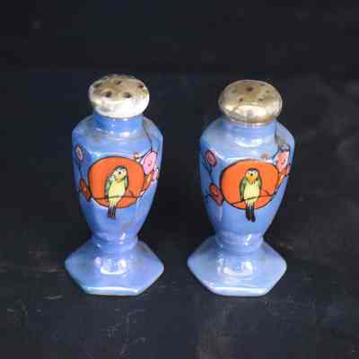 Vintage blue lusterware salt and pepper shakers with a bird design. Made in Japan.