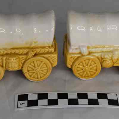 Other side and size comparison of wagon salt and pepper shakers.