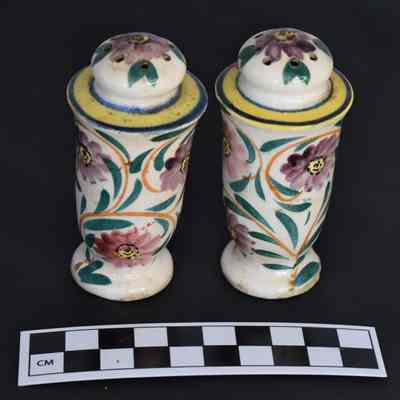 Other side and size comparison of floral salt and pepper shakers.