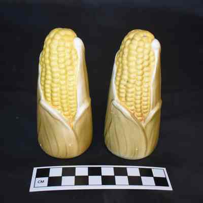 Back and size comparison of the Holt Howard corn salt and pepper shakers.