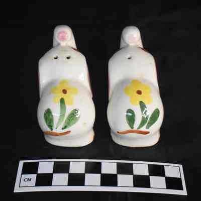 Back and size comparison of the elephant salt and pepper shakers.