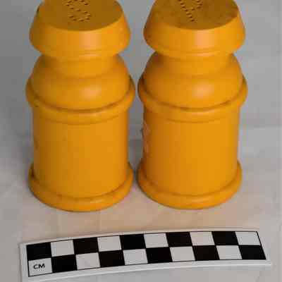 Size comparison of milk can salt and pepper shakers.