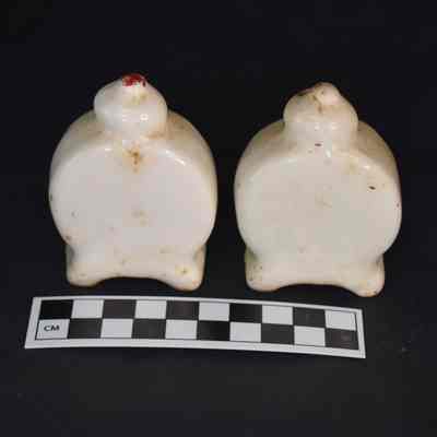Back and size comparison of the clock salt and pepper shakers.