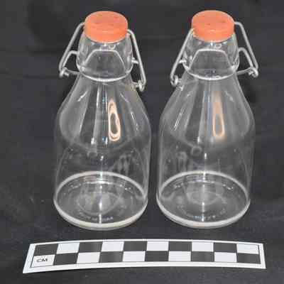 Other side and size comparison of milk bottle salt and pepper shakers.