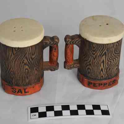 Back and size comparison of Mariner's Inn salt and pepper shakers.