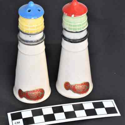 Back and size comparison of lighthouse shakers.