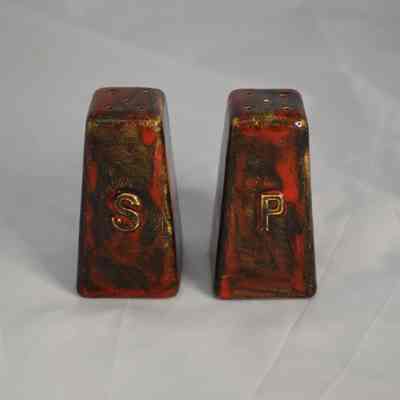 Vintage ceramic salt and pepper shakers with a maple leaf on the back. Made in Vermont.