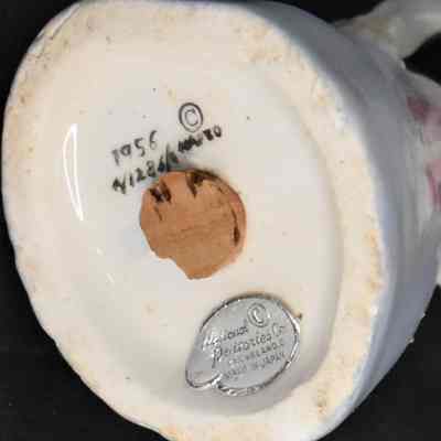 Marks and label on bottom of woman shaker.