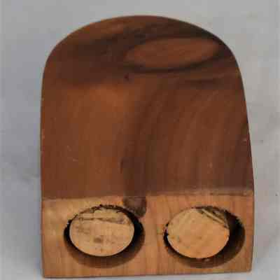 Bottom of combination wooden salt and pepper shaker.