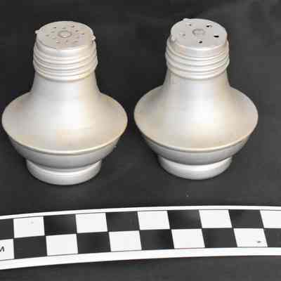 Other side and size comparison for aluminum salt and pepper shakers.
